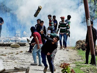 youth killed in kashmir violence, two policemen arrested