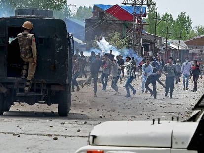 youth killed in kashmir violence, two policemen arrested