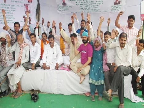 RJD workers sitting on dharna