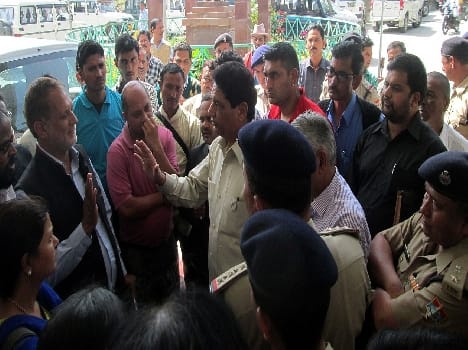 Protesting against the minister of health in development Building
