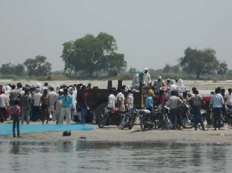 Two young men in Aligarh Immersed in Ganges