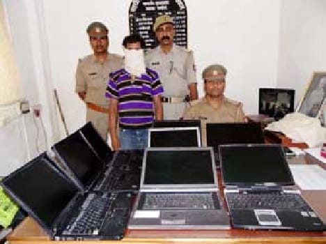 Arrested along with eight laptop .