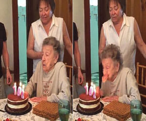 grandma blows out her bday candles, teeth set comes out