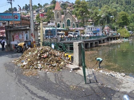 Naini Lake is full of litter