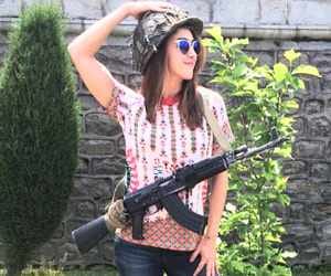 actress lauren gottlieb courts controversy for posing with AK47