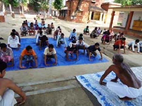 inmates doing meditation in jail
