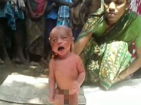 two day old baby is grabbed by the neck