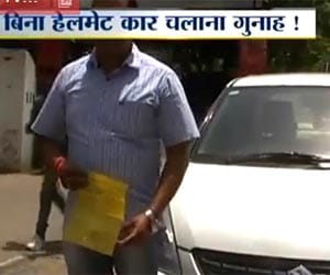 car driver challaned for not wearing helmet