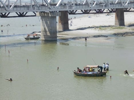 Rajasthan dip The young man immersed in Ganges
