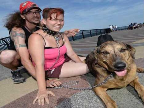 Meet the man who takes his girlfriend with dog collar and lead 