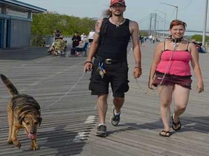 Meet the man who takes his girlfriend with dog collar and lead 