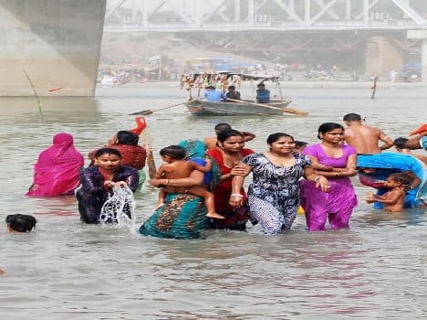 Four persons, including a woman Immersed in the Ganges , two afloat
