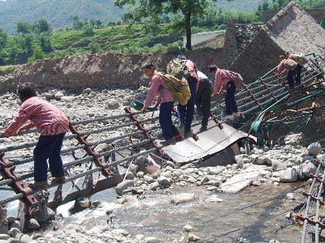flood has swept bridge over the river