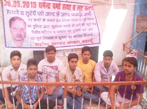 Jewellery artisan 's family sat on lay