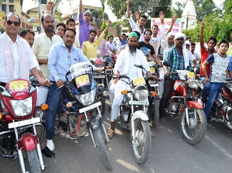 Activists rally around the extracted vehicle