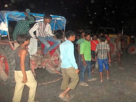 Four injured in collision of car and tractor , jam