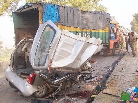 The truck hit the car , killing four