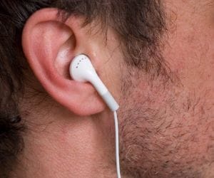 train hits a boy wearing ear phone 