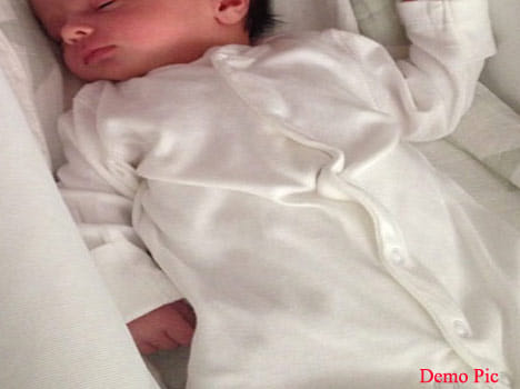 The  innocent baby left at temple in rainy pouring night. 