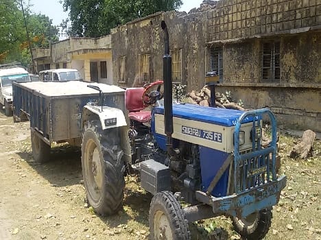 Provost in charge try to reclaim the tractor trolley