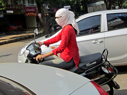Why are women in Delhi helmet cut short?