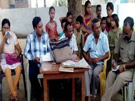 village head and his son beat the teacher