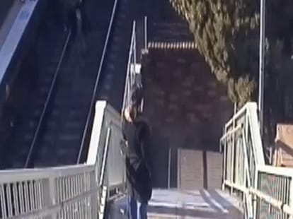 grandfather jumps in front of speeding train to save grandchild in Australia