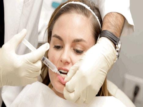 woman using lip injection for attractive lips