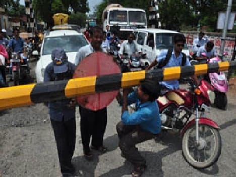 Railway crossing boom then hit the vehicle, damaged