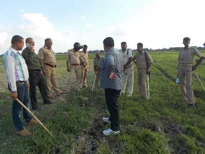 Villagers protest against  a Police team in UP.