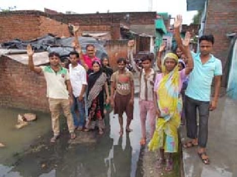 Dirty water flowing down the street , walking difficulty