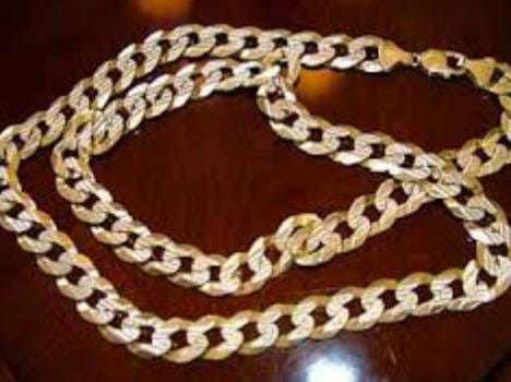 a man pounce gold chain from woman
