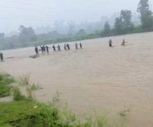 youth stuck in flood at dehradun.