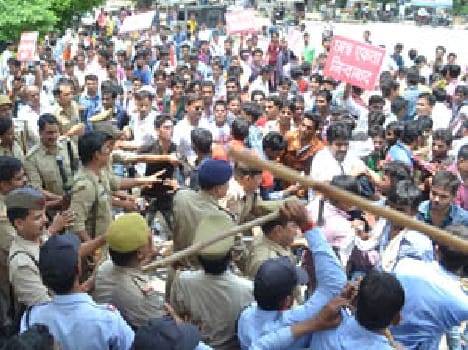 Guard beaten , police hit sticks