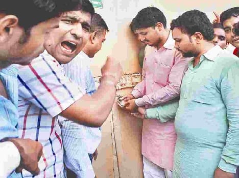protest in front of torrent power office
