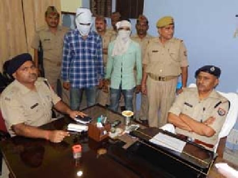 Two arrested for robbery at petrol pump