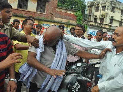 person beaten by mother and daughter