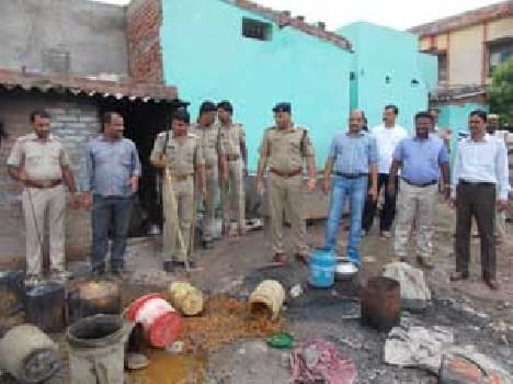 Kanjd township police raid killed , nine arrested