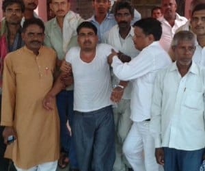 A businessman beaten by Police men.