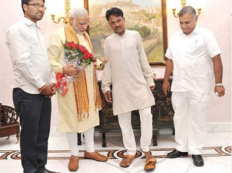 man vows not to wear footwear until he meets modi, PM helps