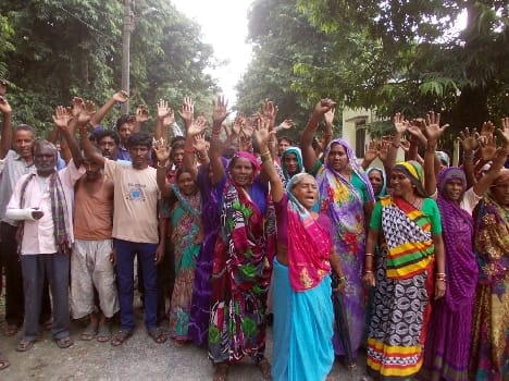 Angry villagers perform at Dudhwa headquarters