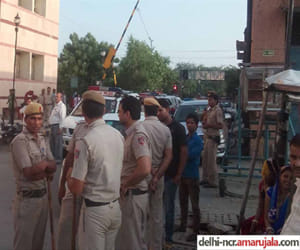 Tihar prisoners being brought by the police give party to police