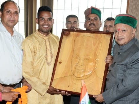 boy gifted a wood painting to cm virbhadra singh.