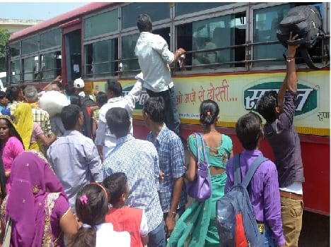 Bus passengers thronging crowd