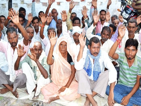 Farmers angry at not receiving compensation, squatted