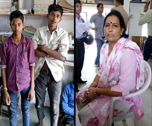 woman bravely grabbed two young man entered in her house