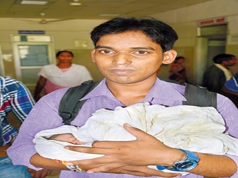 Two-day-old girl thrown, scratched by dogs