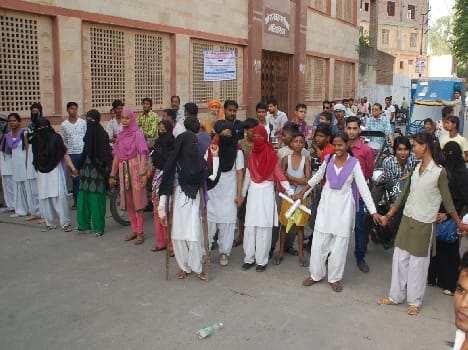 students stood on street for Laptops 