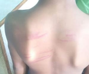 A teacher beats student brutally.