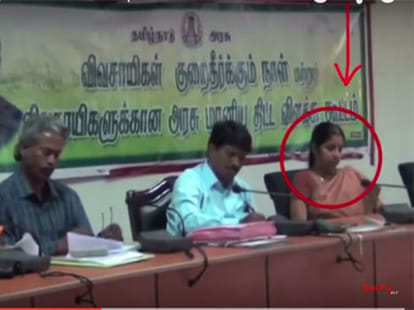 lady officer playing candy crush game at farmer meeting